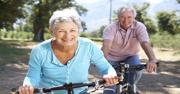blog picture of elderly couple riding bicycles