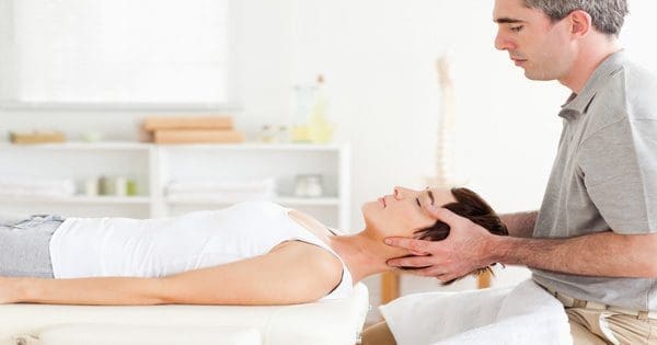 blog picture of chiropractor adjusting patient's neck