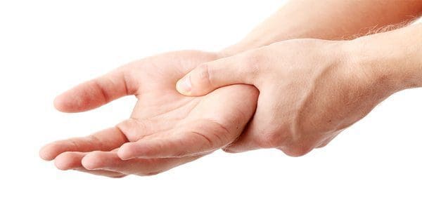 blog picture of man grabbing hand in pain