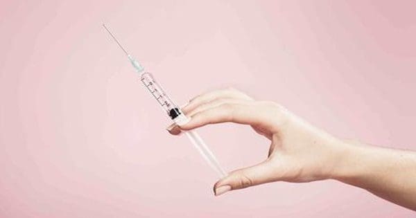 blog picture of hand holding syringe