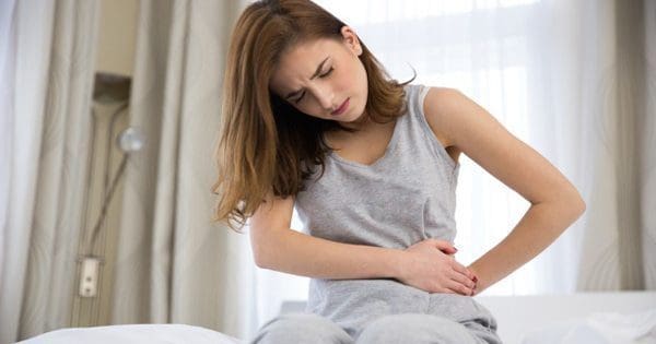 blog picture of lady with stomach pain