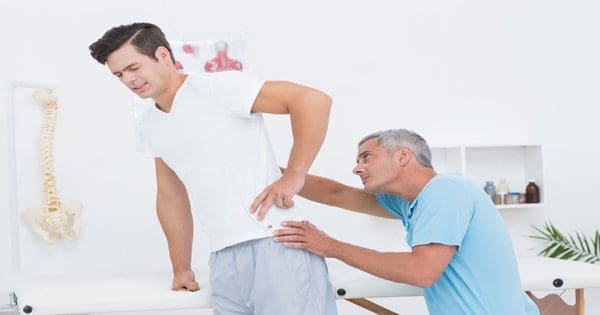 blog picture of man getting checked by a chiropractor
