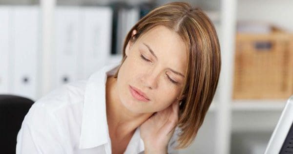 blog picture of lady at her desk having neck pain