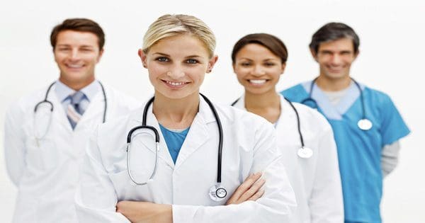 blog picture of two male doctors and two female doctors together smiling