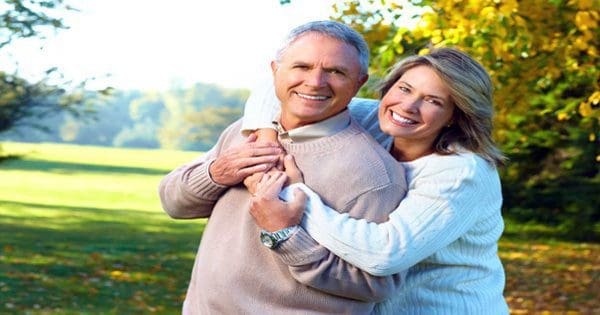 blog picture of older couple hugging in a park