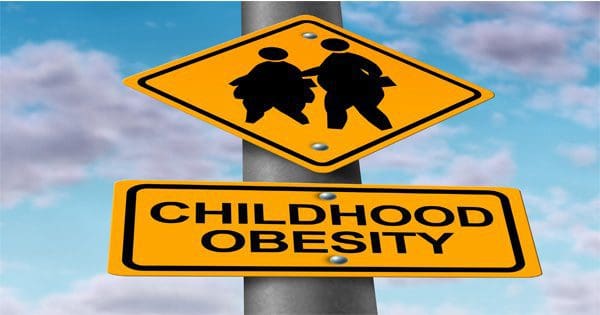 blog picture of street signs that show overweight children silhouette and the words childhood obesity
