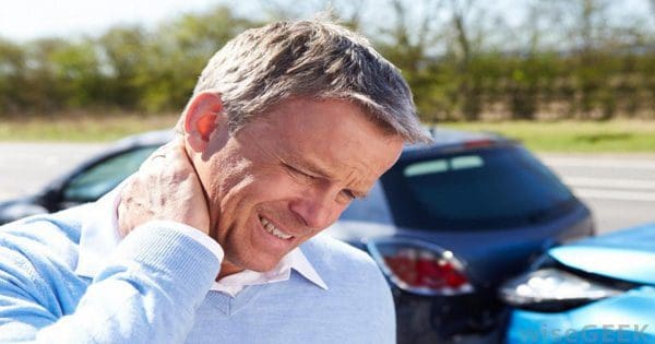 blog picture of man in auto accident rubbing the back of his neck
