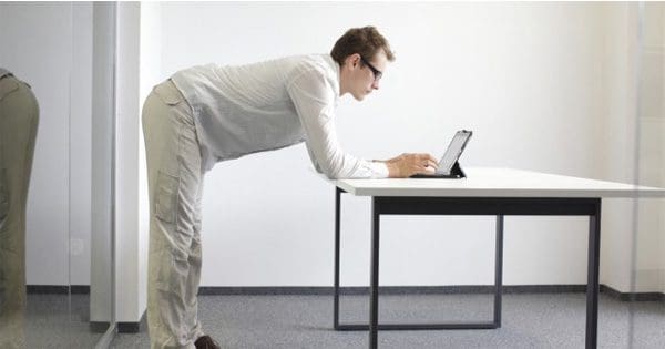 blog picture of man standing at desk
