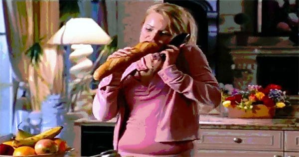 blog picture of lady eating an entire bread loaf