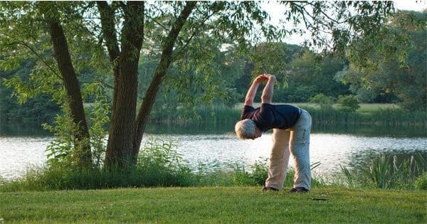 blog picture of elderly man doing yoga