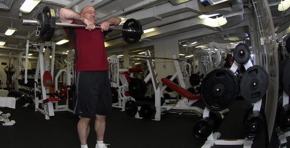 blog picture of older man in gym lifting weights