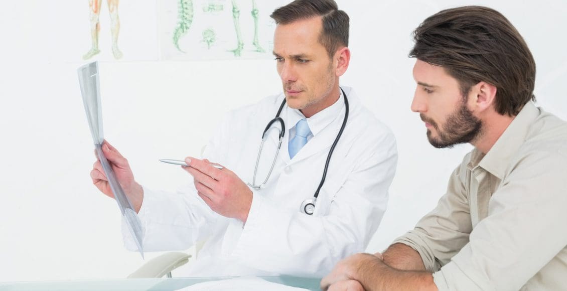 doctor explaining spine ray to patient