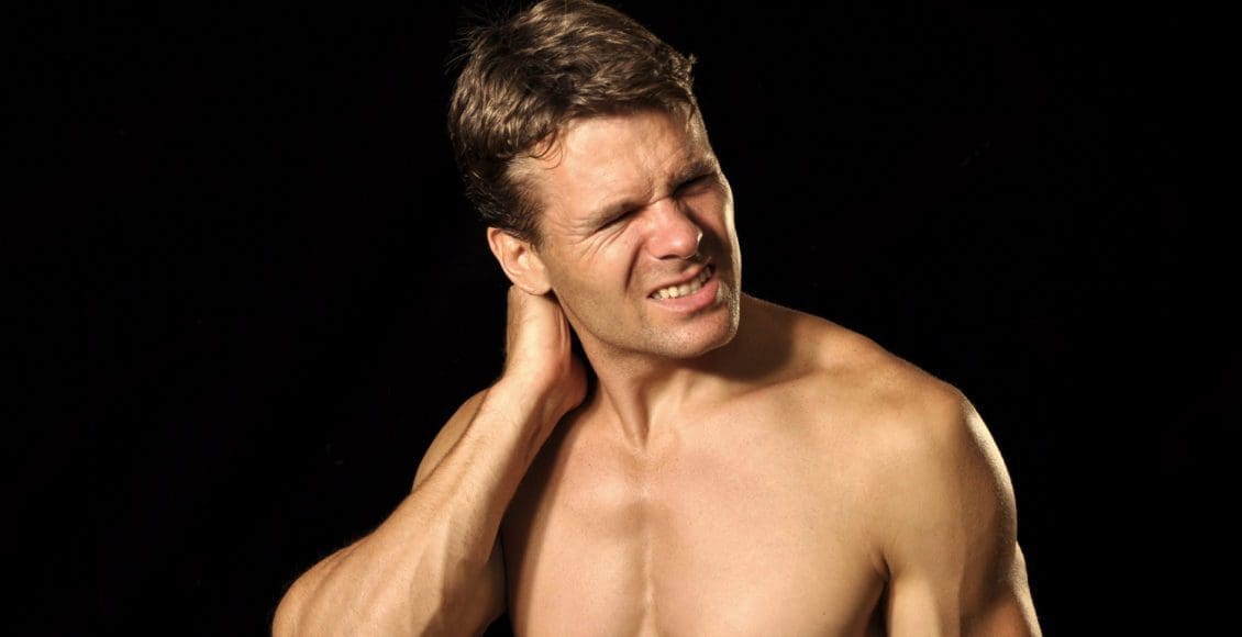 male athlete suffers from acute neck pain