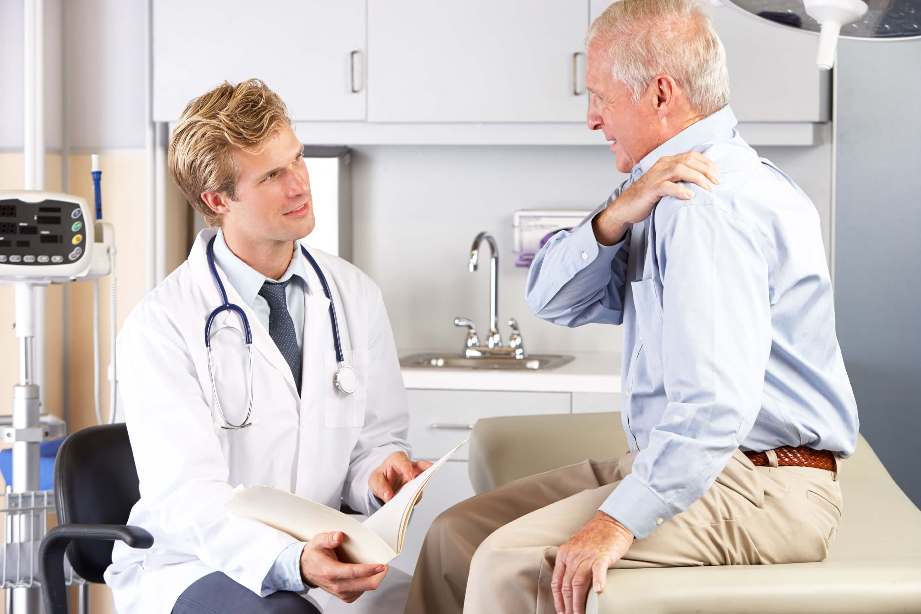 Older male patient visits healthcare professional for shoulder pain.
